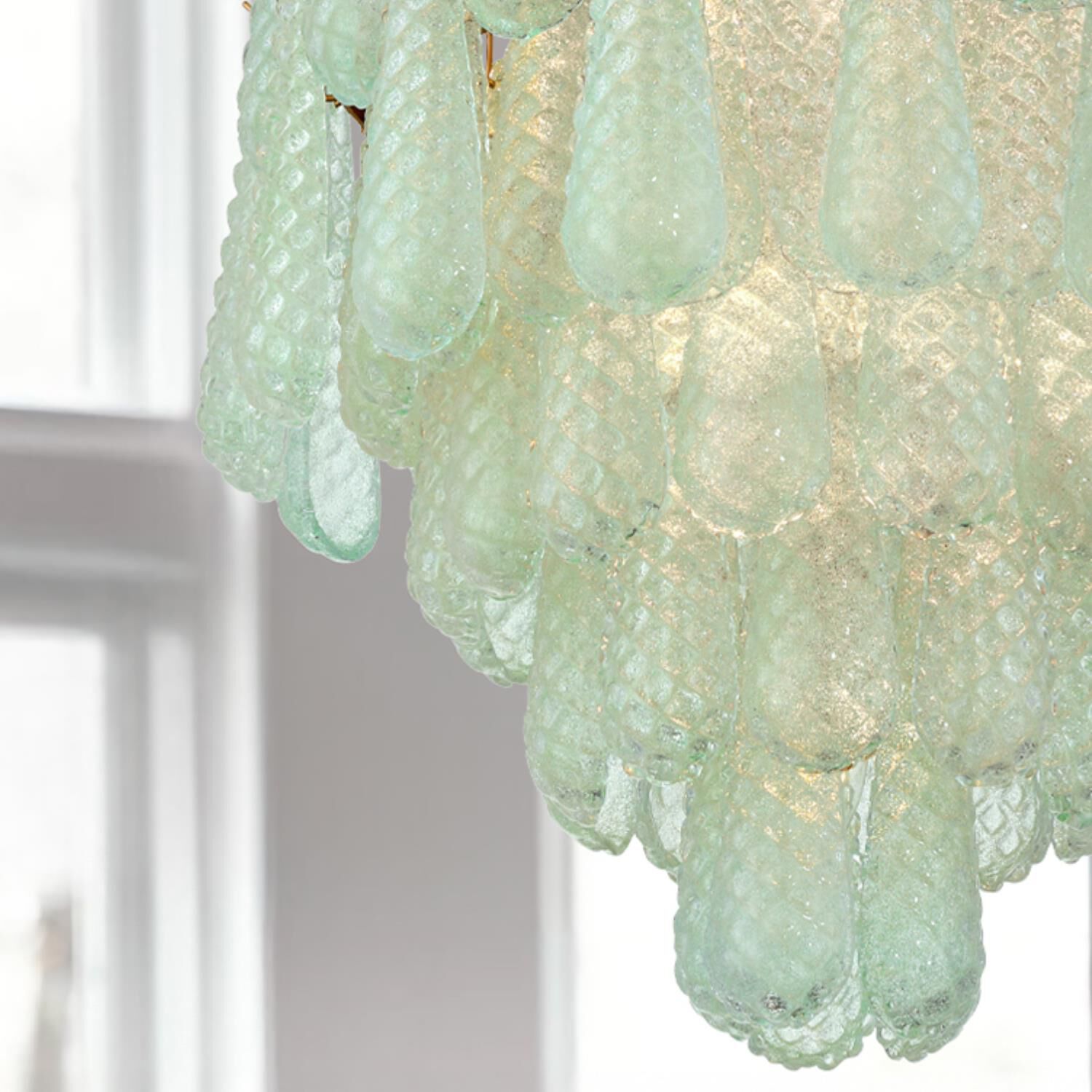 Shown in Aged Brass finish and Sand Green glass